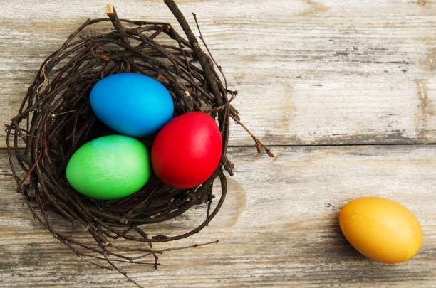 istock Easter eggs on a wooden background .Easter eggs of different colors .Easter eggs top view 933283252