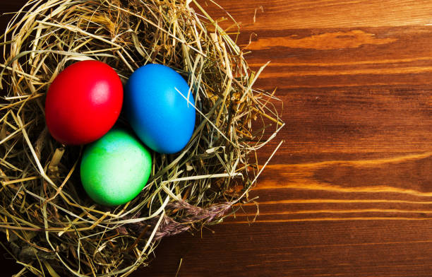 istock Easter eggs on a wooden background .Easter eggs of different colors .Easter eggs top view 933283256