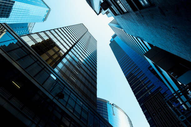 istock Bottom up view of Modern office building in Hong Kong 933294822