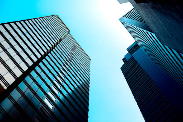 istock Bottom up view of Modern office building in Hong Kong 933294832