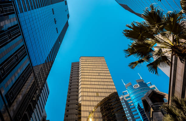 istock Bottom up view of Modern office building in Hong Kong 933294852