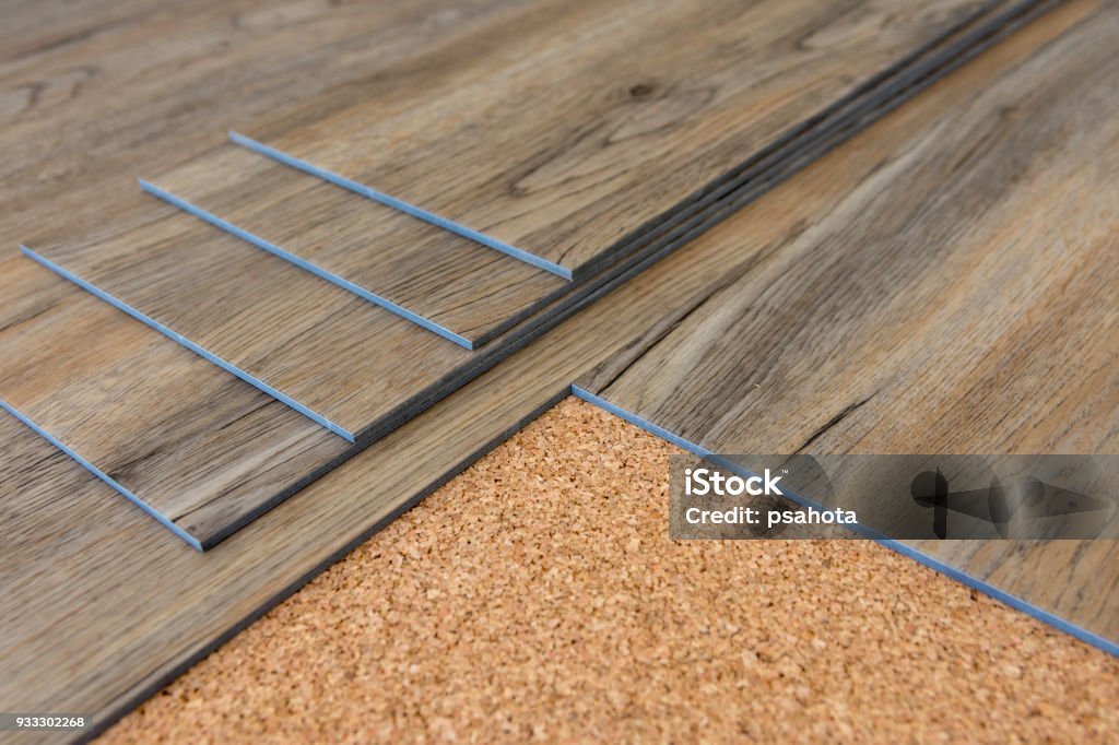 Vinyl plank New luxury vinyl plank installation on cork,modern home,renovate concept Flooring Stock Photo