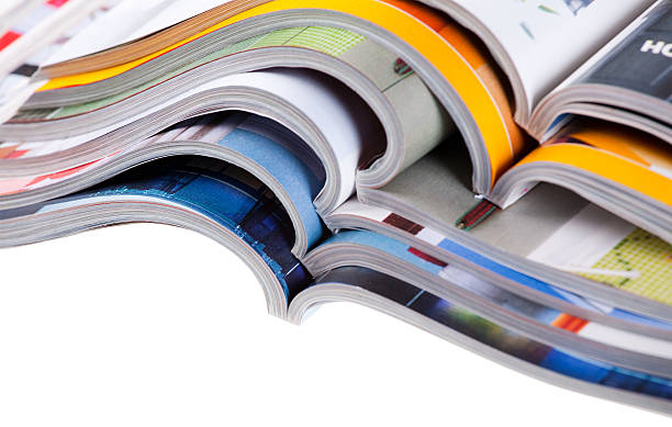 istock Pile of different types of magazine in white background 93330817