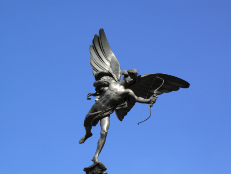The aluminium statue of Eros the greek mythological  God Of Love, stands at the top of The Shaftesbury Memorial Fountain in London's Piccadilly Circus