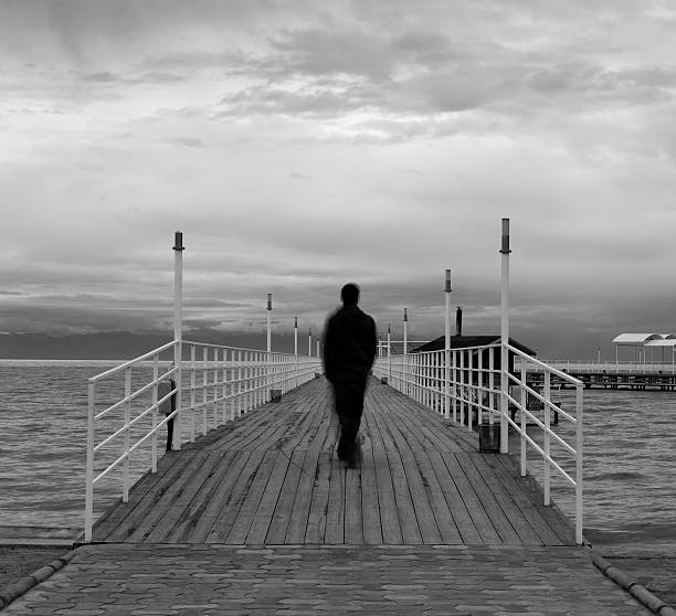 istock Blurred silhouette on a quay, black and white 93331181