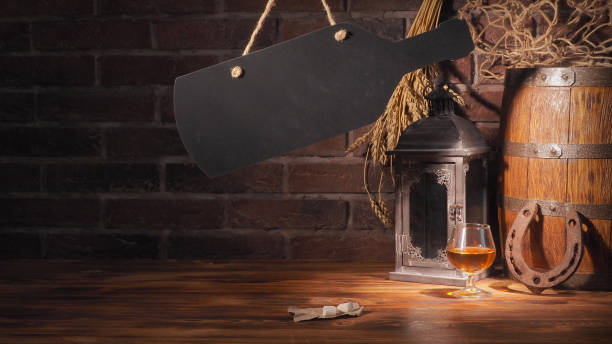 istock Glass of cognac with barrel on brick backgroun 933312620