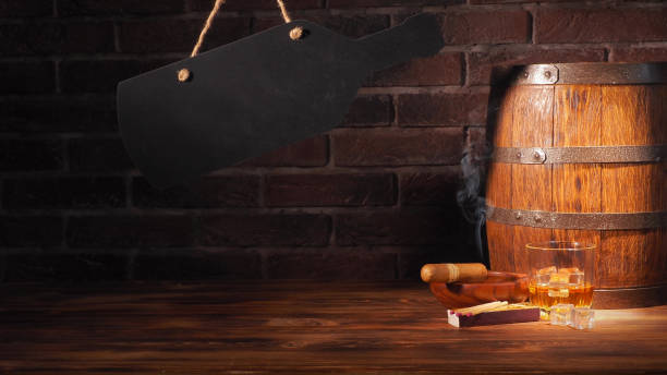 istock Glass of cognac with barrel on brick backgroun 933312806