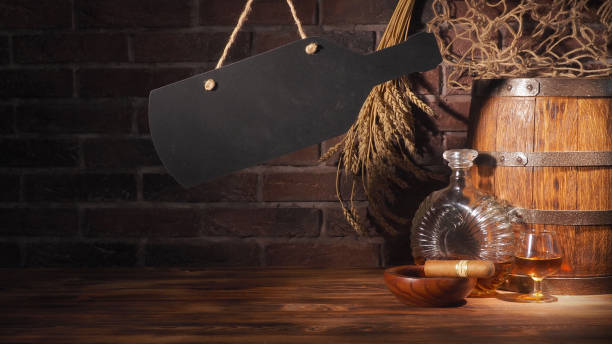 istock Glass of cognac with barrel on brick backgroun 933312886