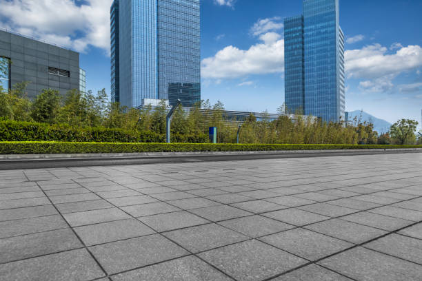 istock Empty pavement front of modern office buildings 933318338