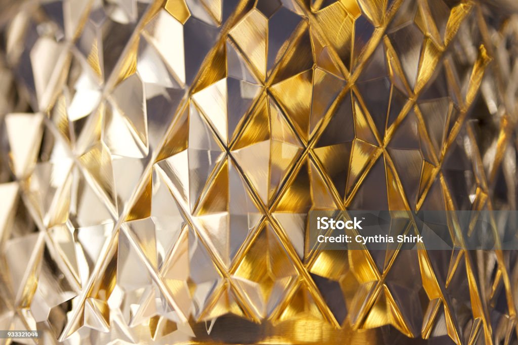 Macro abstract background of brilliant diamond facets on lead crystal This close-up image features hand cut diamond shape facets on beautiful lead crystal glassware Glass - Material Stock Photo