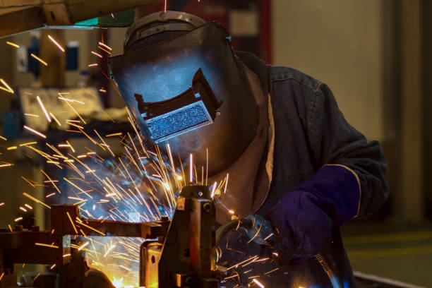 istock Worker is welding in factory 933323728