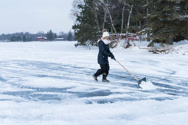 istock Creating an ice skating area on a frozen lake 933326010