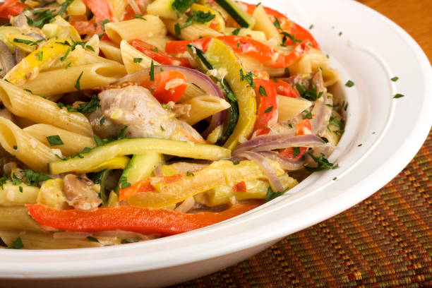 istock Penne pasta with chicken, onions, peppers and parsley 93333043