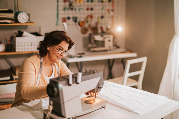 istock Sawing for living... 933333718