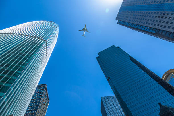 istock Plane flying over the skyscrapers 933344332