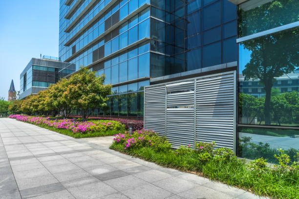 istock Empty pavement front of modern office buildings 933344692
