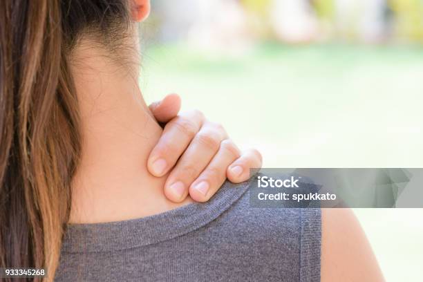 Closeup Woman Neck And Shoulder Pain And Injury Health Care And Medical Concept Stock Photo - Download Image Now