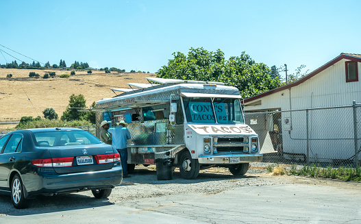 Three Rivers, California, USA - June 15, 2017: Tourist transport and fast food on the highway in California. Summer vacation and travel in California, USA. Road to the Sequoia National Park and the Kings Canyon. Rest on weekends