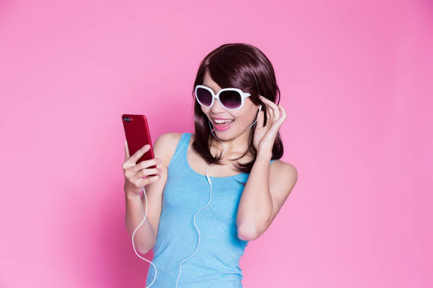 istock woman use phone listen music 933373042