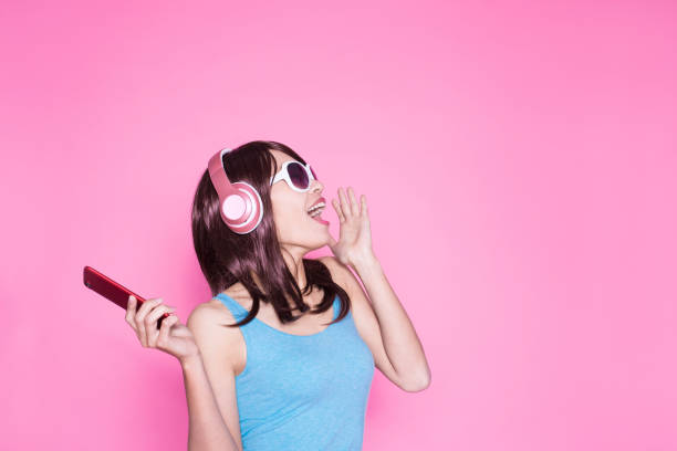 istock woman use phone listen music 933373226