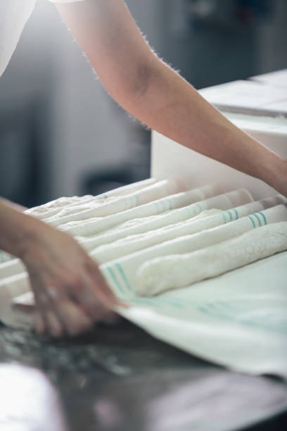 istock Baker preparing bread. Close up of hands kneading dough. Bakery concept. 933373672