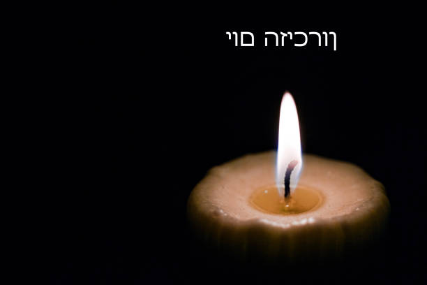 istock Memorial Day, burning candle, Text, Hebrew, 933374074