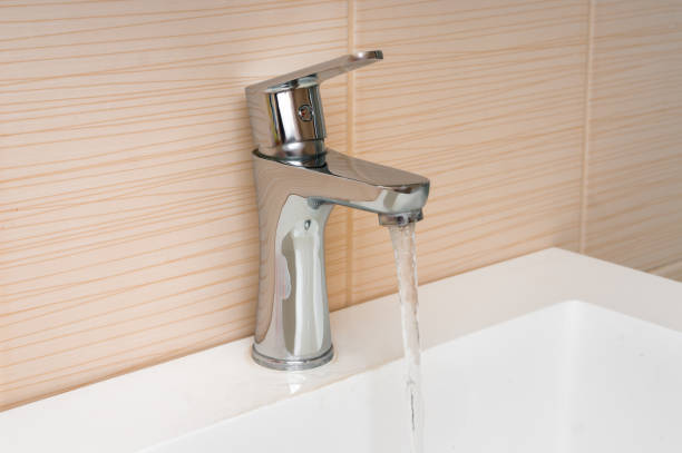 istock Water running from a tap - waste of water 933380908