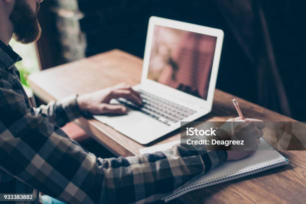 People Management Employment Marketing Modern Technology Concept Cropped Close Up Photo Of Smart Intelligent Focused Concentrated Clever Guy Doing Home Task Writing Information To Copybook Stock Photo - Download Image Now