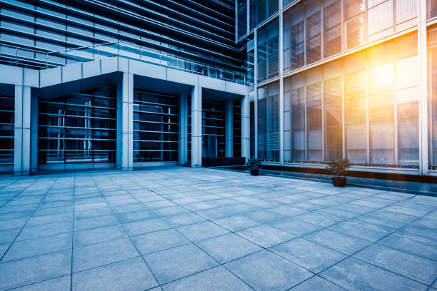 istock Empty brick road nearby office building 933384088
