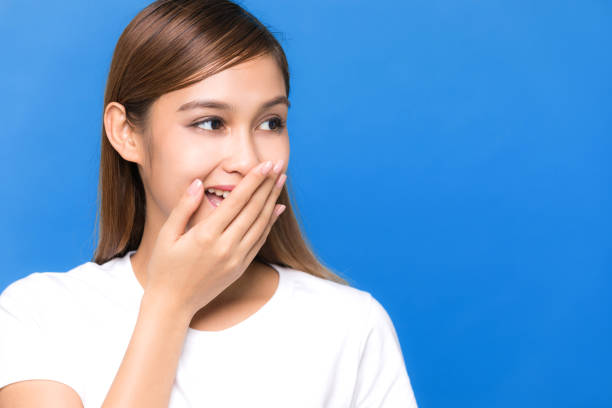 istock Young woman being suppressed smile 933389544