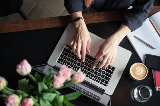 istock female blogger writing on the laptop 933399440
