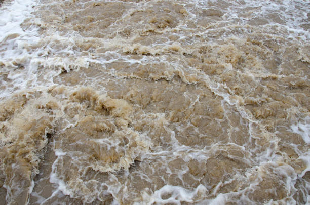 istock Turbid flood waters flow over rapids after heavy rains 933401852