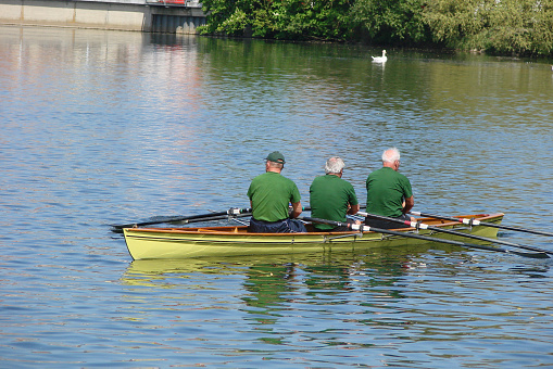 Seniors rowing on the river Neckar in Nuertingen in Germany.