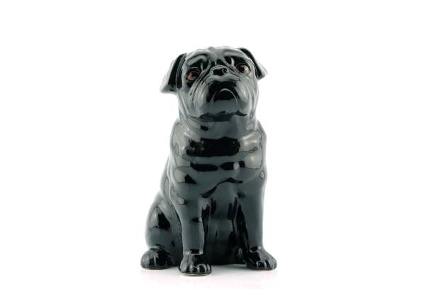 Black dog statue On a isolated white background.