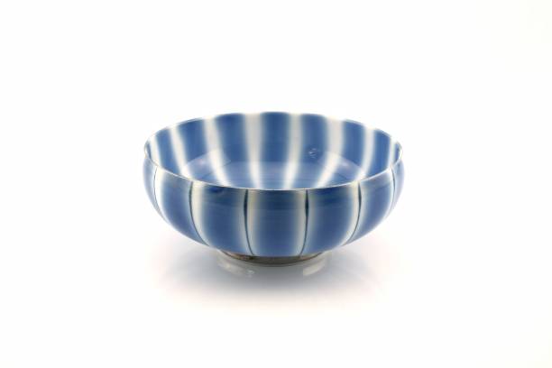 istock Blue and white striped bowl isolated on white background. 933405184