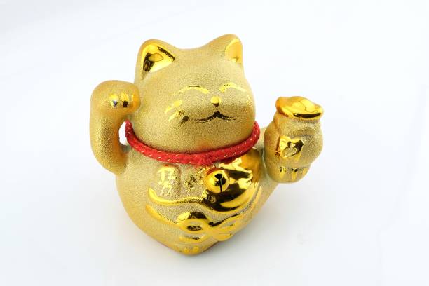 istock Maneki Neko Gold color isolated over white background. 933407486