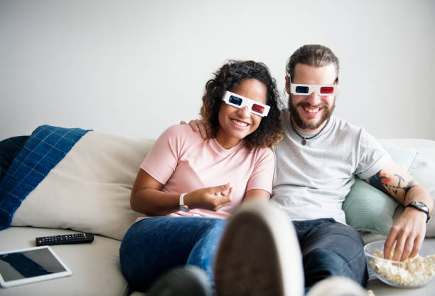 istock Couple watching 3D movie together 933418260