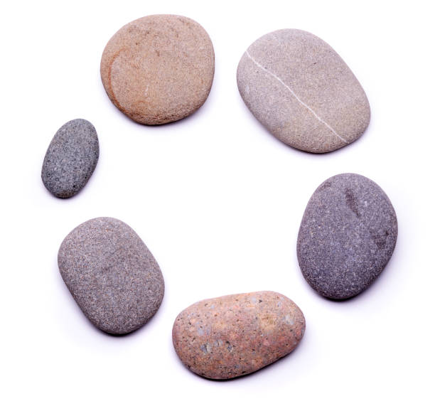 Circle of pebbles Circle of pebbles isolated on white background stone object stock pictures, royalty-free photos & images