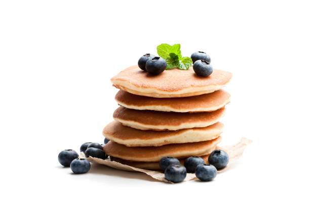istock Stack  of scotch pancakes with fresh blueberry isolated on white 933419072