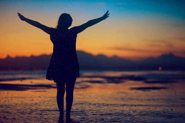 istock freedom silhouette on the beach 933419076
