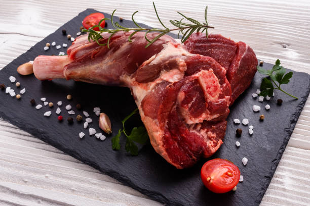 istock fresh lamb meat on a textured stone plate 933427806