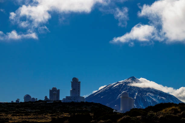Observatory stars park near el teide vulcan mountain installation to observe the sky and the stars with el teide vulcan in background. outdoor, winter scene with technology and environment activity science related. observatory tenerife canary islands el teide national park stock pictures, royalty-free photos & images