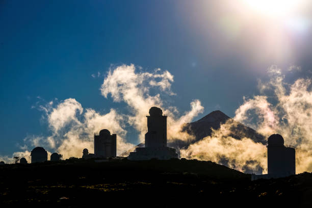 Observatory stars park near el teide vulcan mountain installation to observe the sky and the stars with el teide vulcan in background. outdoor, winter scene with technology and environment activity science related. observatory tenerife canary islands el teide national park stock pictures, royalty-free photos & images