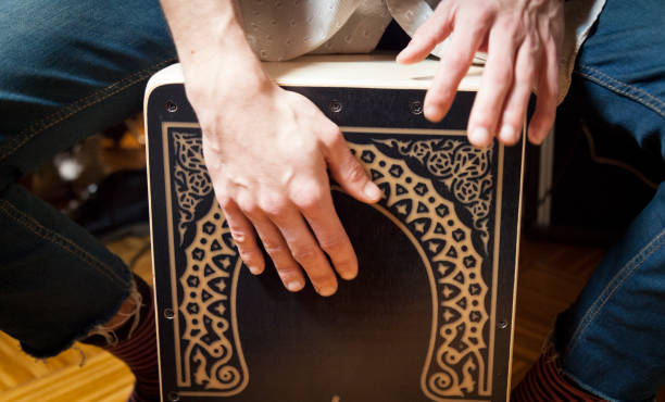 Hands playing percussion with a Flamenco box stock photo