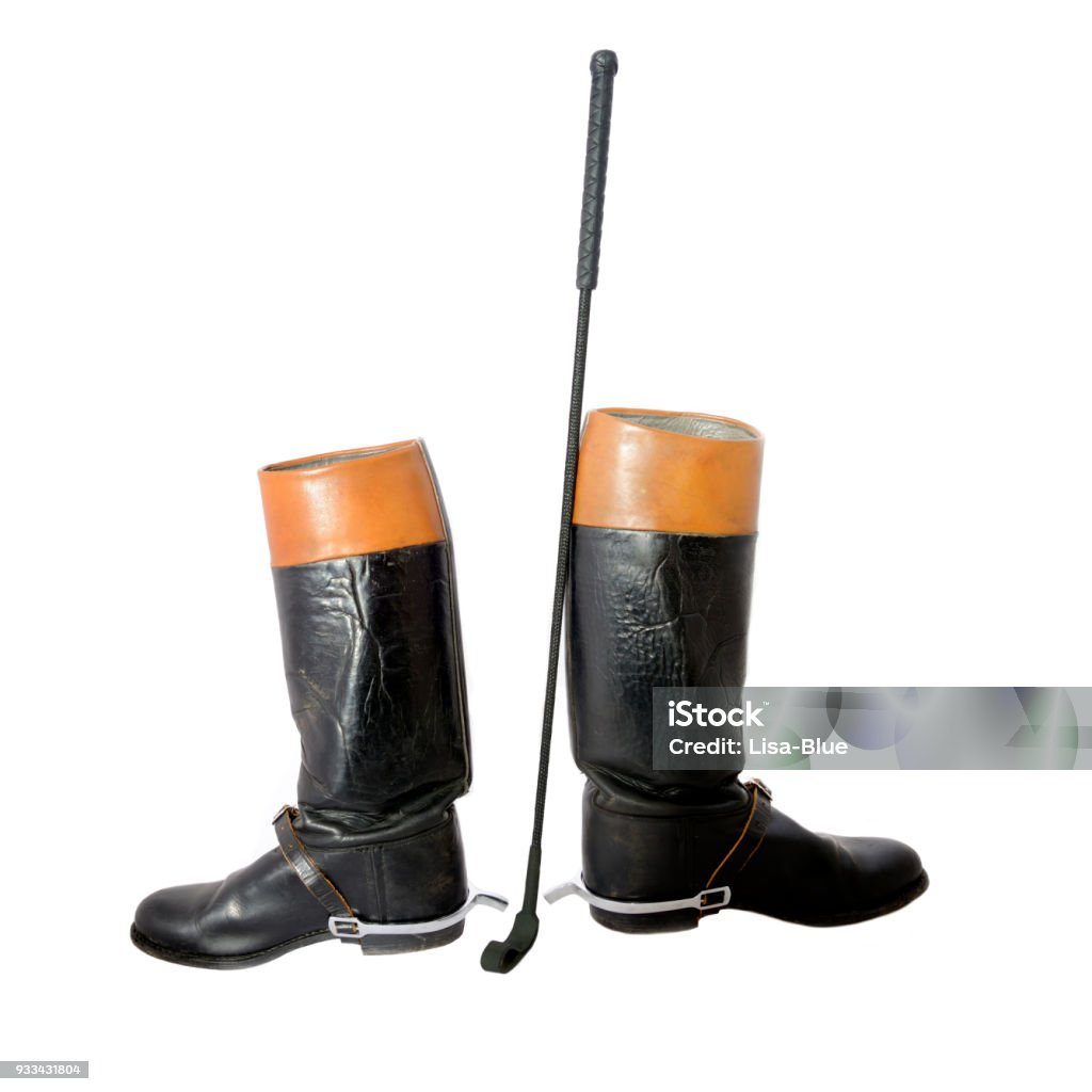 Woman used riding boots with spurs and riding crop Riding Crop Stock Photo