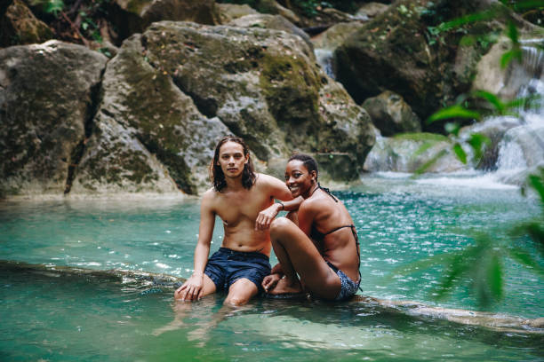 istock Couple enjoying the waterfall 933434100