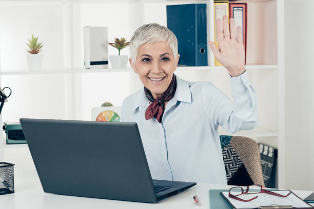 istock Friendly businesswoman greets an associate 933434256
