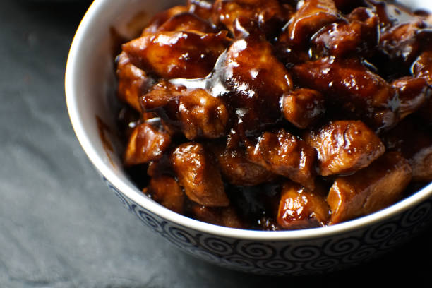 Finished pieces of chicken breast in teriyaki sauce. Asian cuisine stock photo