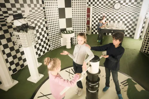 Photo of children with interest play in  chess  quest room