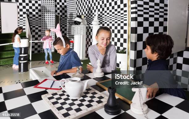 Children Play In Escape Room In Chess Style Stock Photo - Download Image Now - 6-7 Years, 8-9 Years, Atmosphere